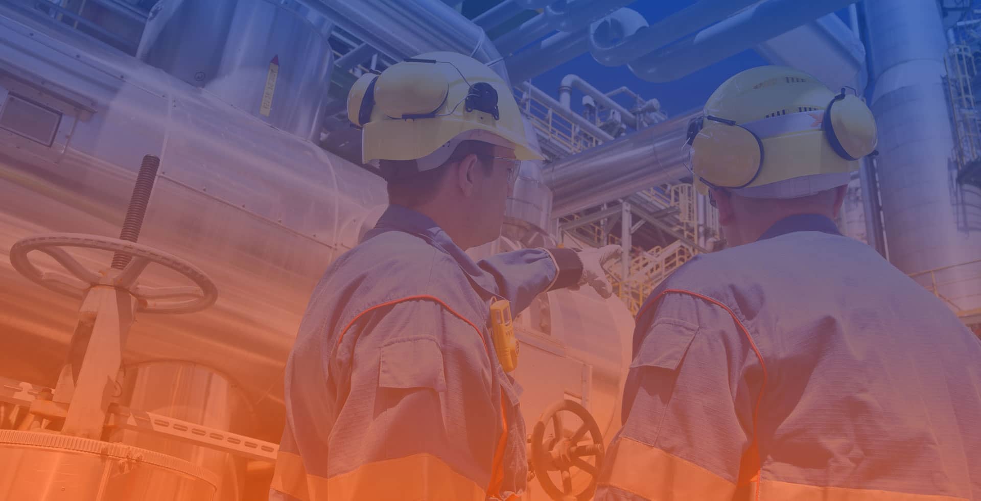 Engineering team inspecting industrial equipment
